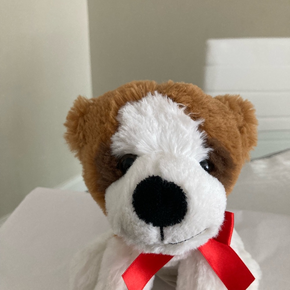 Brown and White Stuffed Dog with Red Bow